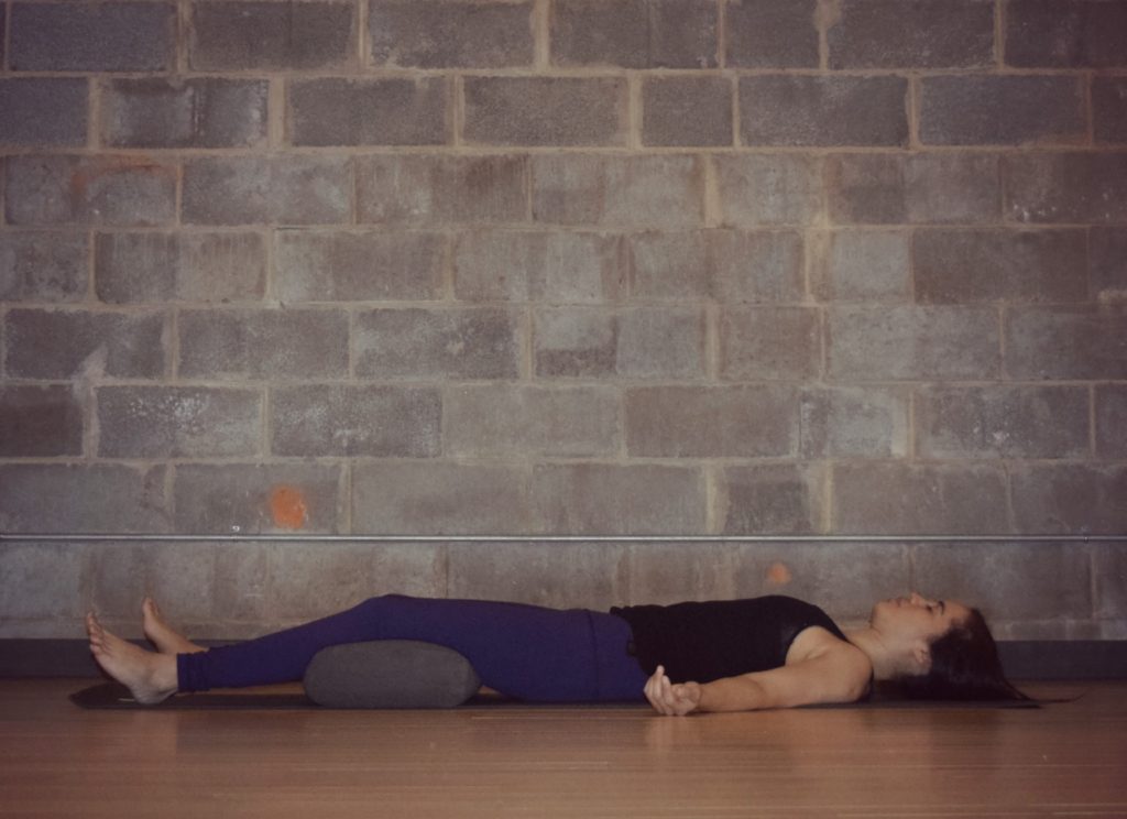 Restorative Yoga - Savasana with bolster