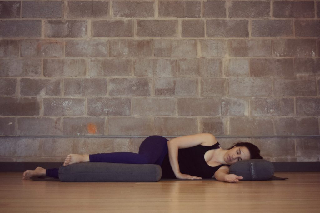 Restorative Yoga Twist with bolsters